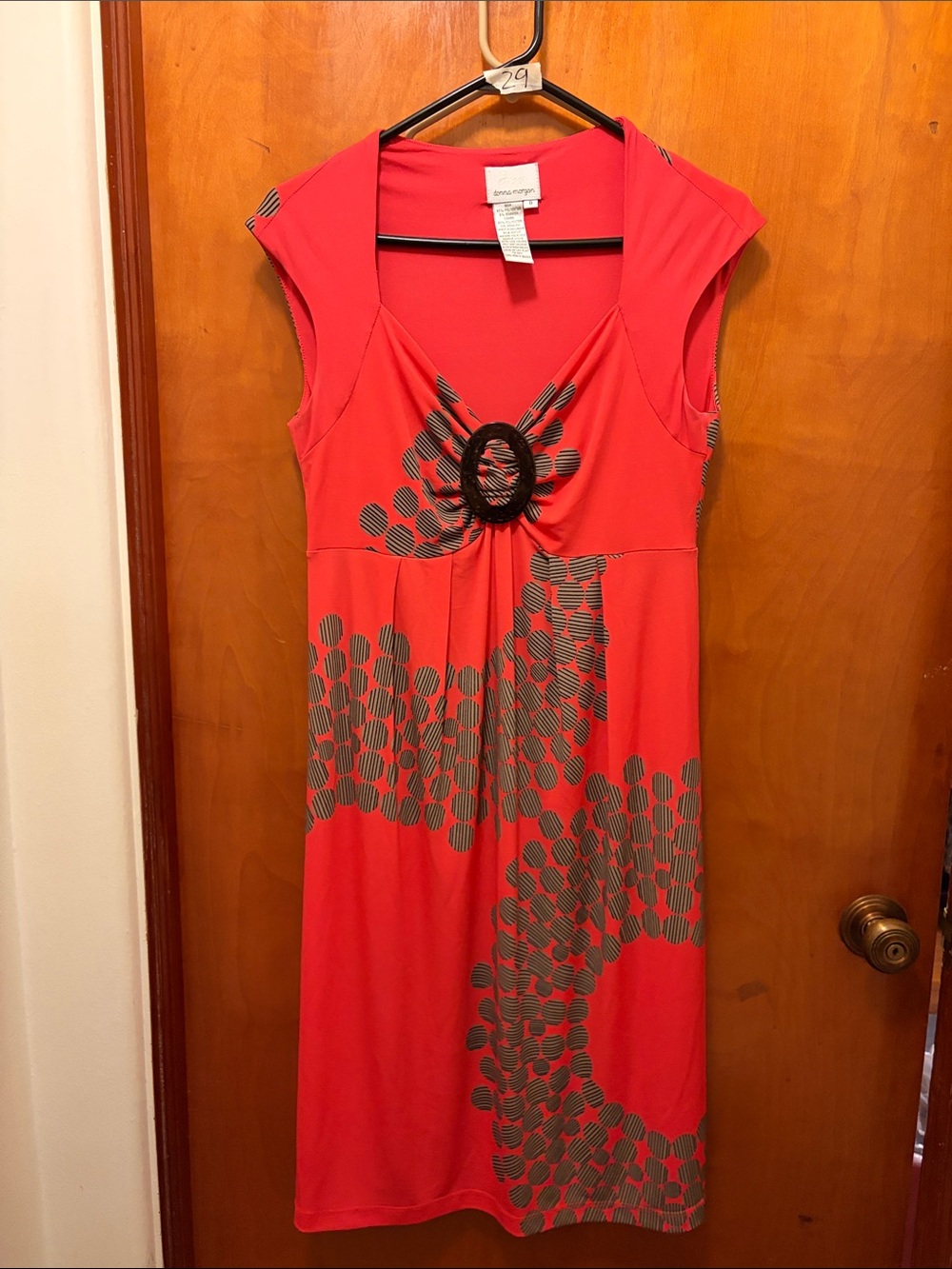 Donna Morgan Coral Dress with Gray Dot Pattern and Front Ring